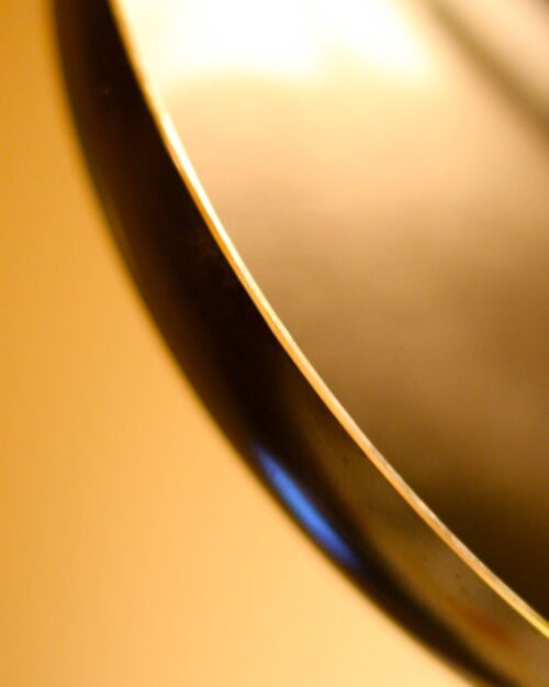 Dark frying pan on a plain background